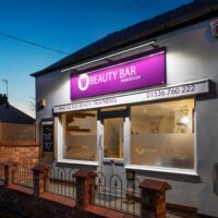 Front of salon Night